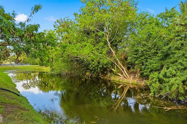a view of lake with green space