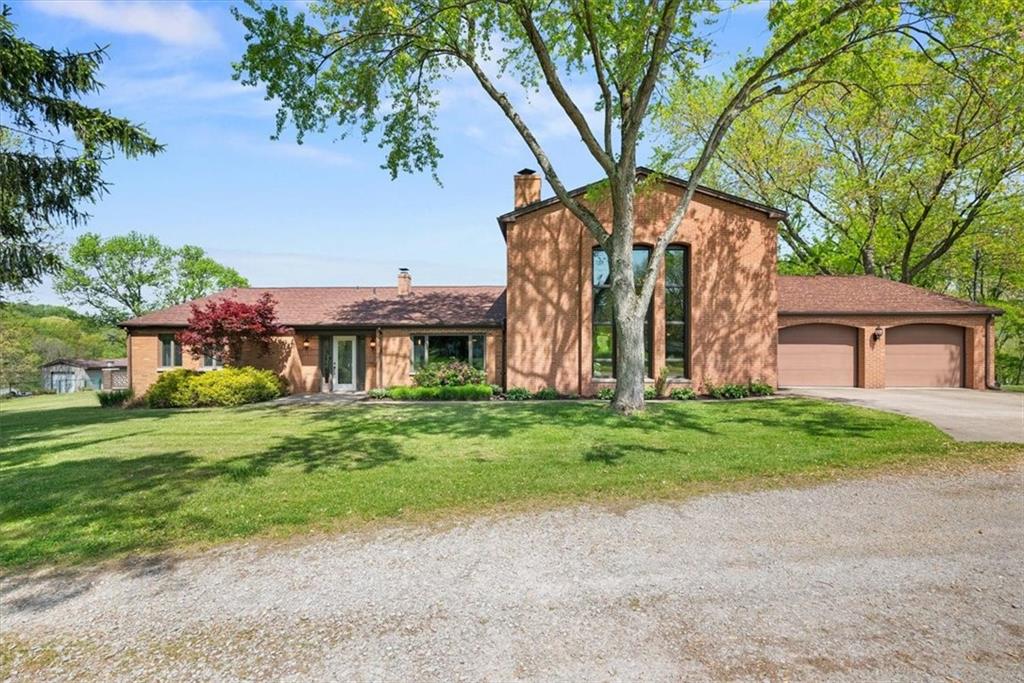 3616 New Texas Road Pittsburgh, PA 15239 - Photo 1 of 25 a front view of a house with garden