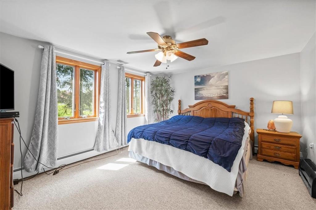 3616 New Texas Road Pittsburgh, PA 15239 - Photo 11 of 25 a spacious bedroom with a bed and a window