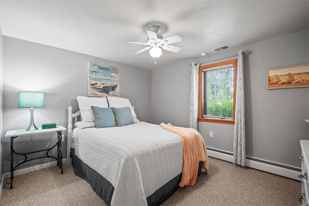 3616 New Texas Road Pittsburgh, PA 15239 - Photo 17 of 25 a bedroom with a bed and a chandelier