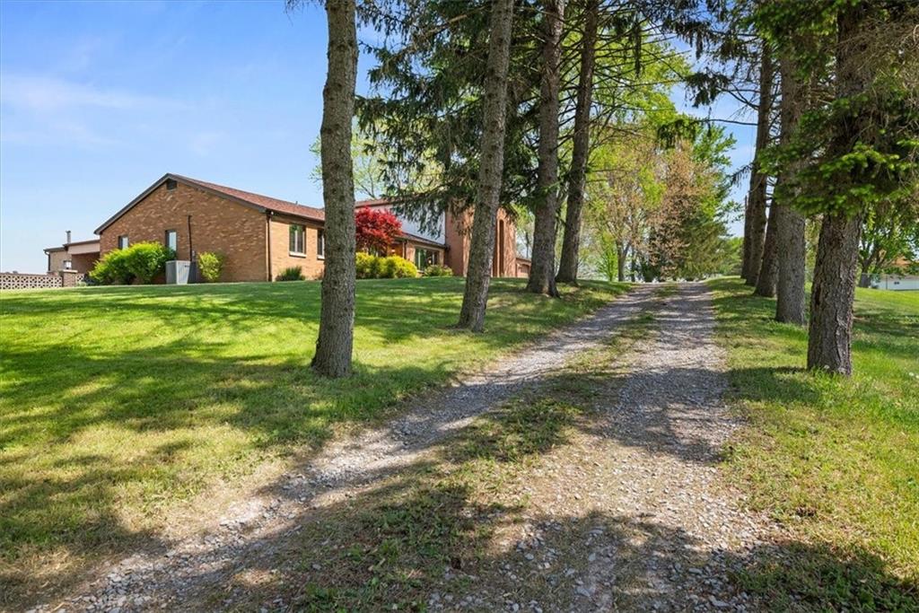3616 New Texas Road Pittsburgh, PA 15239 - Photo 23 of 25 a view of a house with a yard