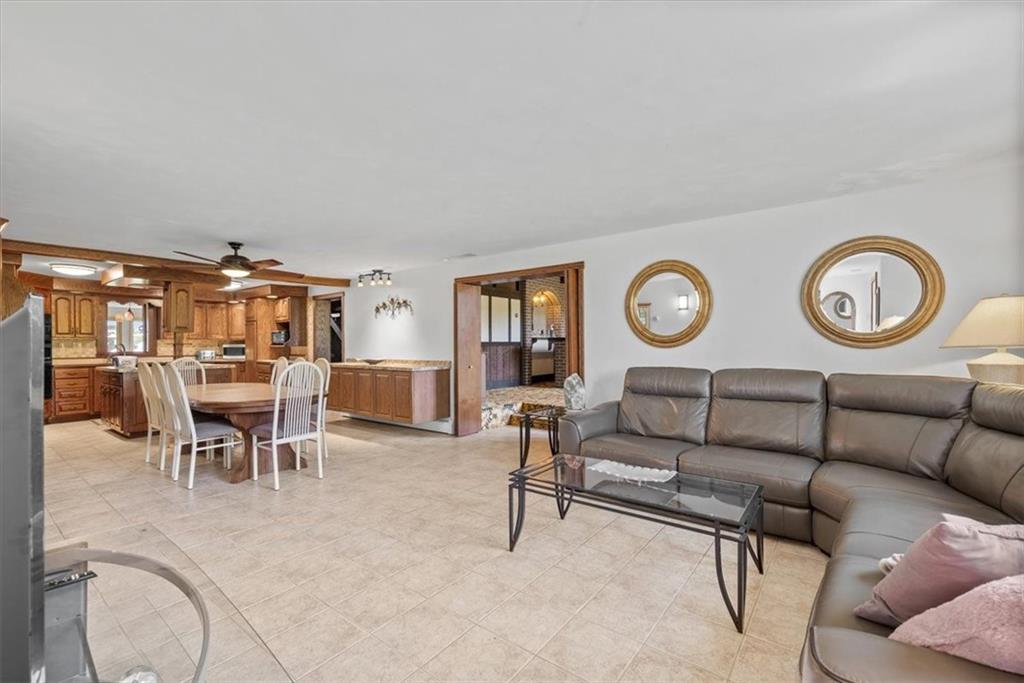 3616 New Texas Road Pittsburgh, PA 15239 - Photo 5 of 25 a living room with furniture and a clock
