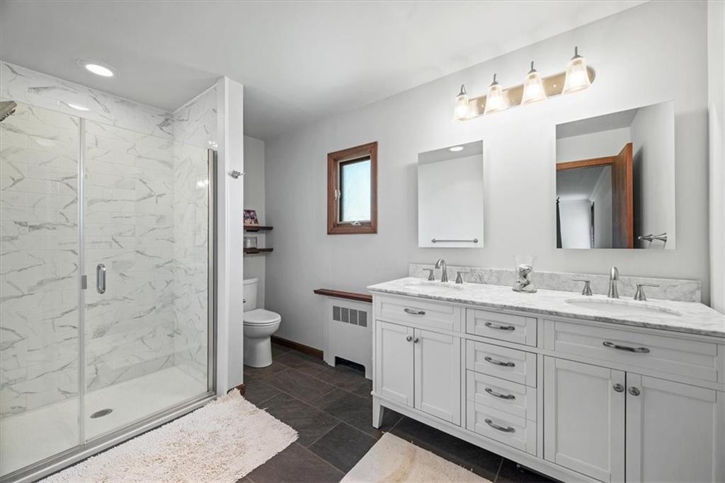 3616 New Texas Road Pittsburgh, PA 15239 - Photo 7 of 25 a bathroom with a double vanity sink mirror and toilet