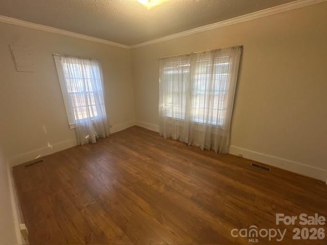 2073 State Rd S-28-522 Bethune, SC 29009 - Photo 12 of 14 an empty room with wooden floor and windows