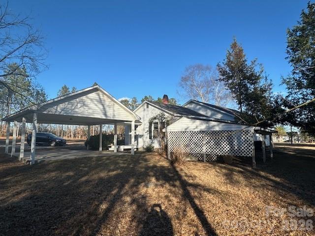 2073 State Rd S-28-522 Bethune, SC 29009 - Photo 4 of 14 a front view of a house with a yard