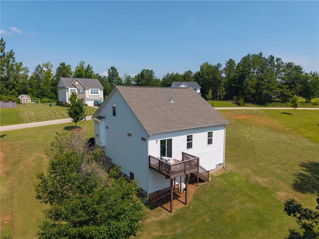 768 Rocky Ridge Circle Seneca, SC 29678 - Photo 30 of 30 An aerial perspective reveals a two-story residence with a generous rear deck, nestled amidst a verdant landscape.