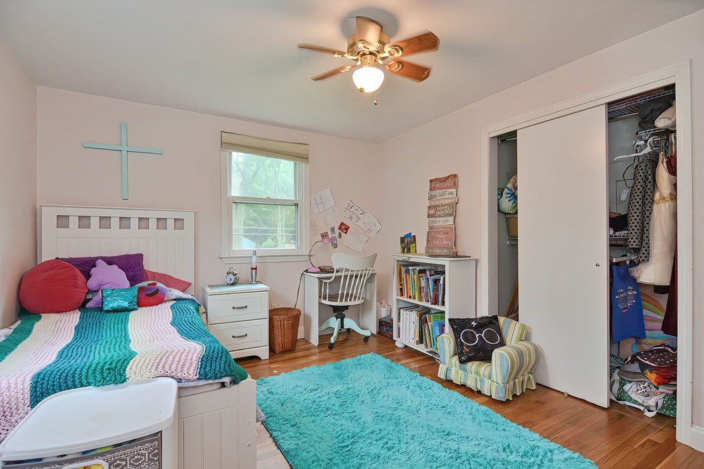 23 Carpenter Road Northbridge, MA 01588 - Photo 21 of 38 a bedroom with a bed and a chandelier