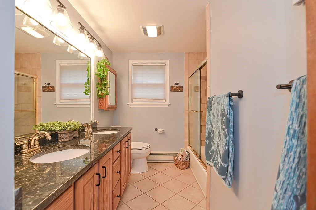 23 Carpenter Road Northbridge, MA 01588 - Photo 22 of 38 a bathroom with a granite countertop sink toilet and shower