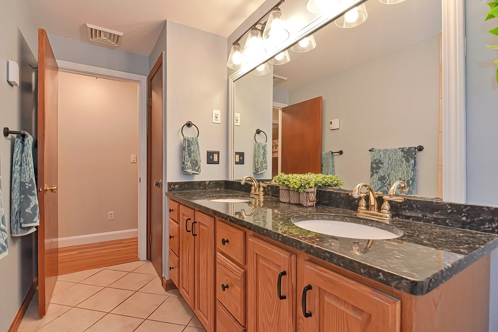 23 Carpenter Road Northbridge, MA 01588 - Photo 23 of 38 a bathroom with a granite countertop sink and a mirror