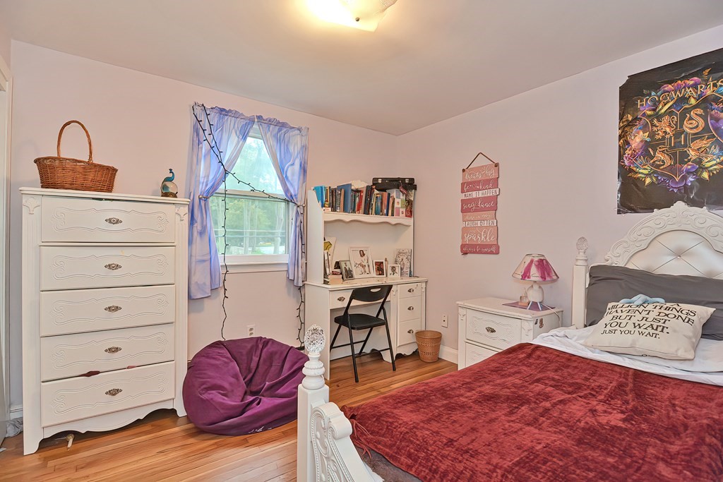 23 Carpenter Road Northbridge, MA 01588 - Photo 25 of 38 a bedroom with a bed and wooden floor