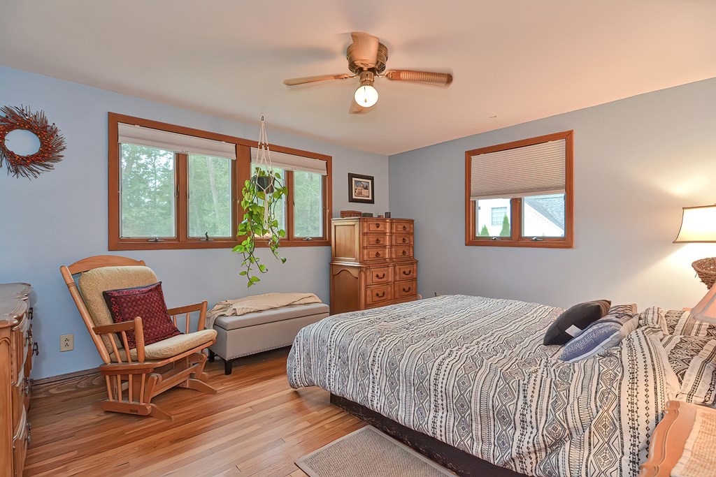 23 Carpenter Road Northbridge, MA 01588 - Photo 26 of 38 a bedroom with a bed a chandelier and a window