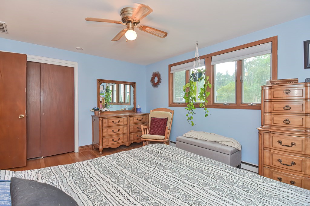 23 Carpenter Road Northbridge, MA 01588 - Photo 28 of 38 a bedroom with a bed and wooden floor