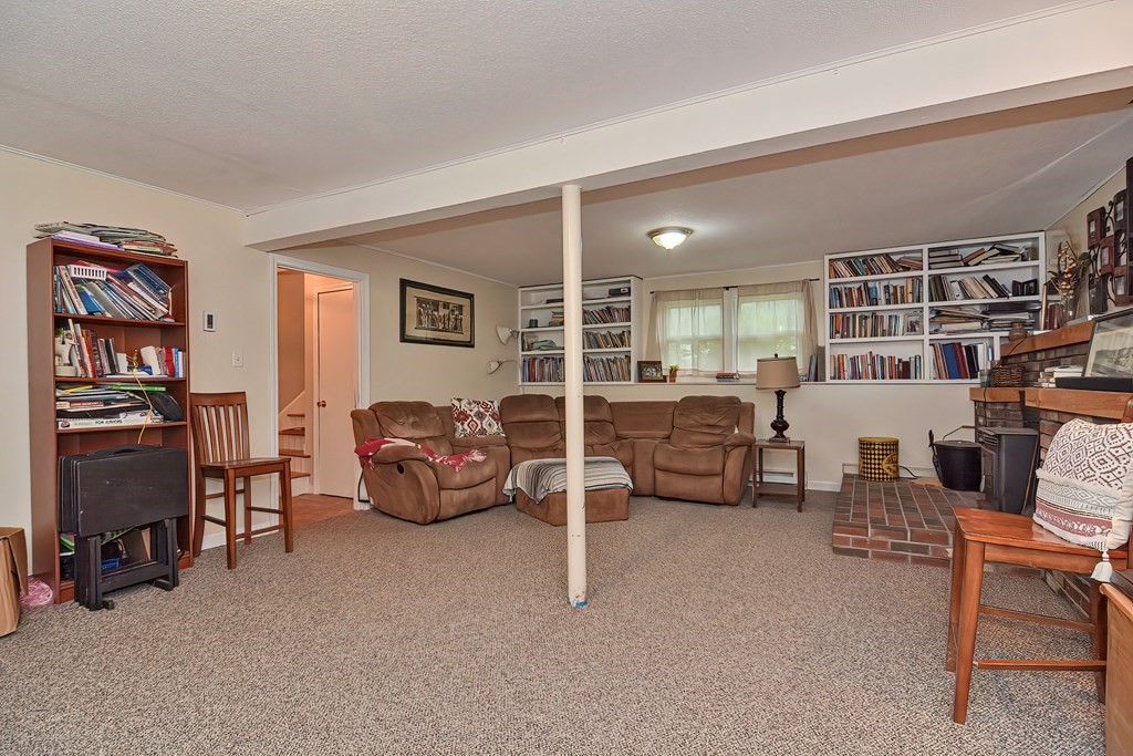 23 Carpenter Road Northbridge, MA 01588 - Photo 29 of 38 a living room with furniture and a flat screen tv