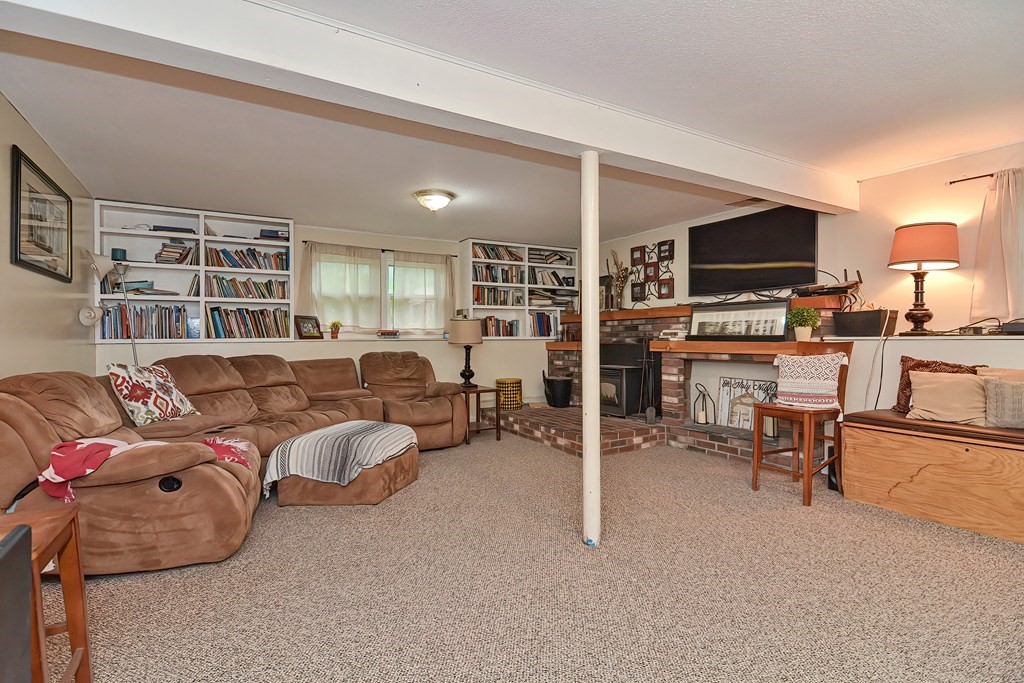 23 Carpenter Road Northbridge, MA 01588 - Photo 31 of 38 a living room with furniture and a flat screen tv