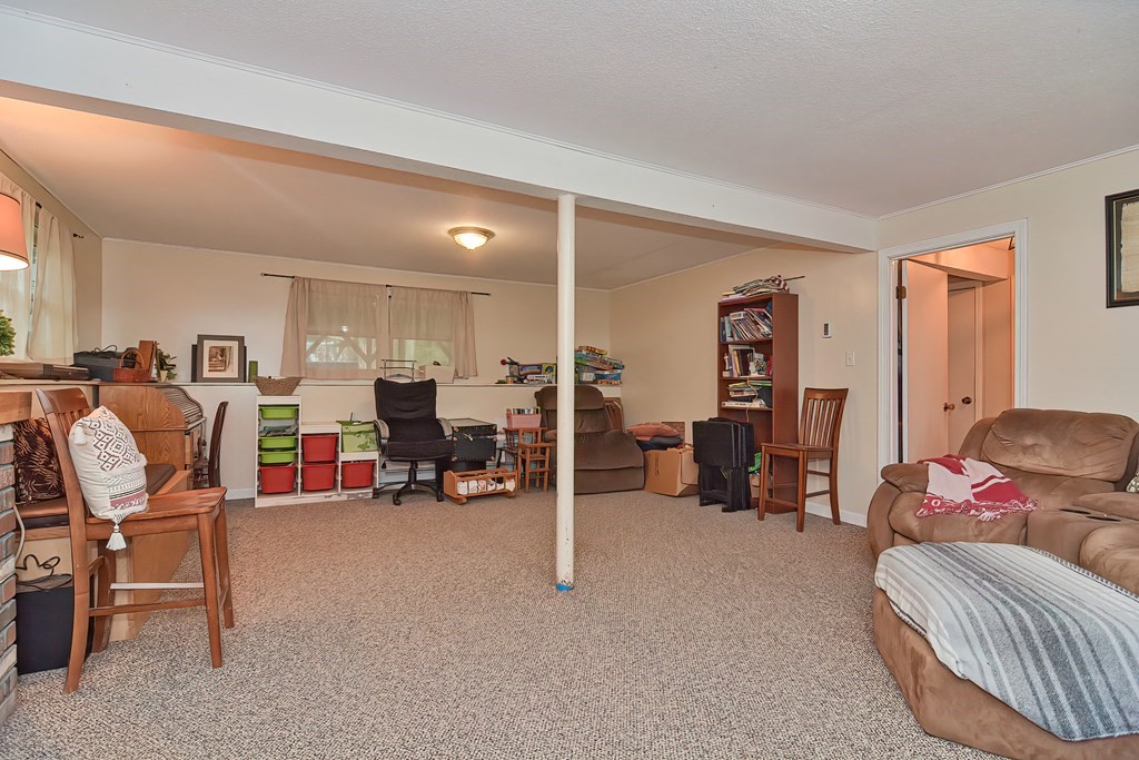 23 Carpenter Road Northbridge, MA 01588 - Photo 32 of 38 a living room with furniture and a large window