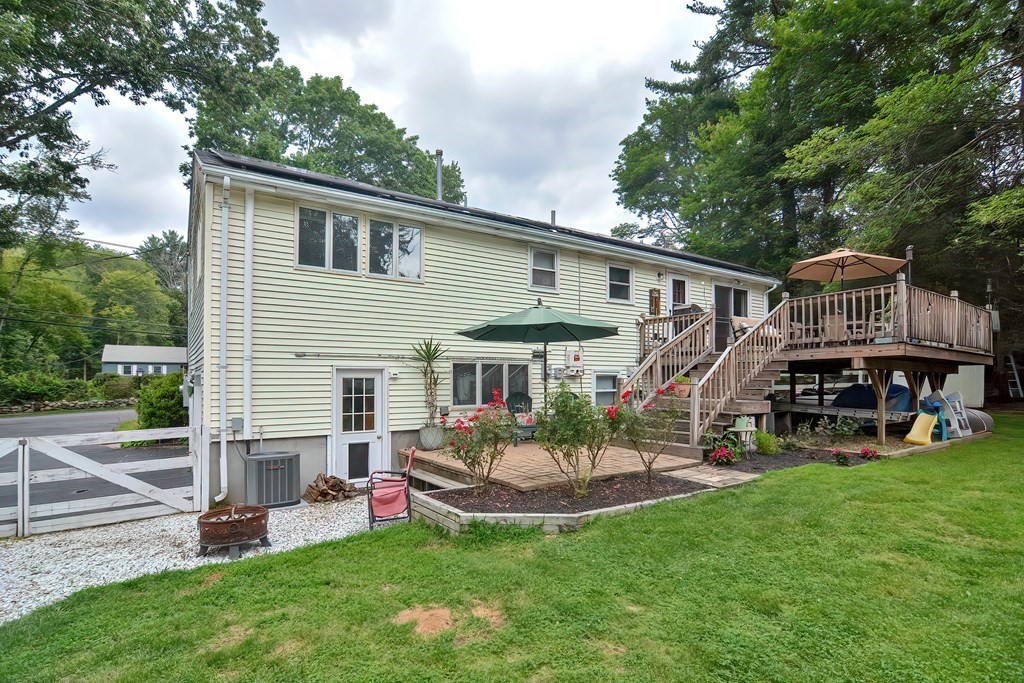 23 Carpenter Road Northbridge, MA 01588 - Photo 4 of 38 a view of a house with a backyard and a patio