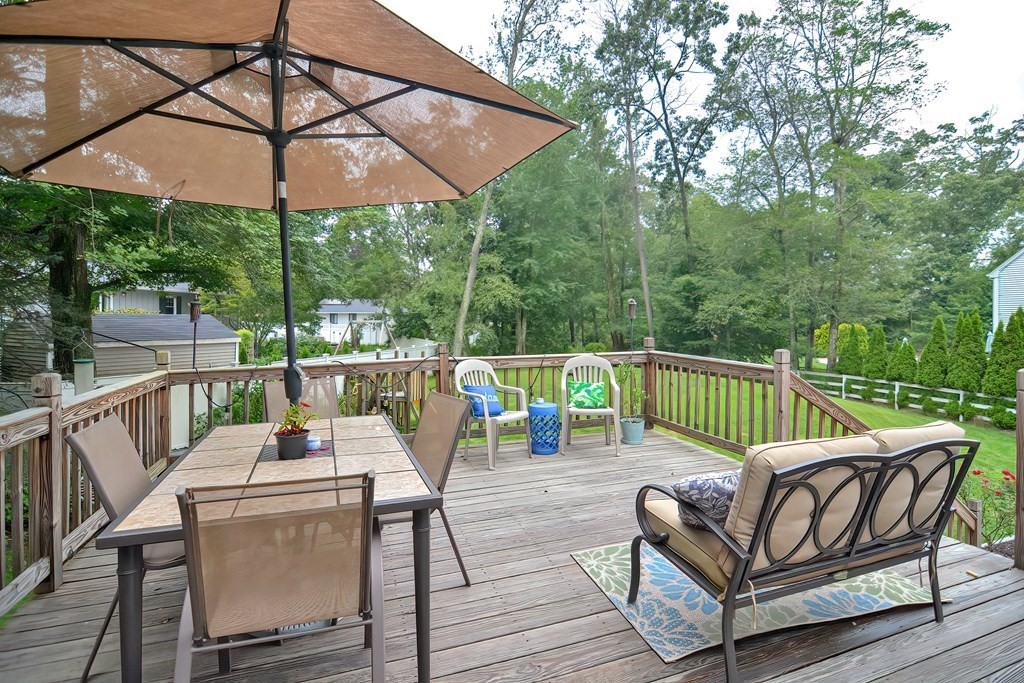 23 Carpenter Road Northbridge, MA 01588 - Photo 6 of 38 a view of a chair and table on the deck