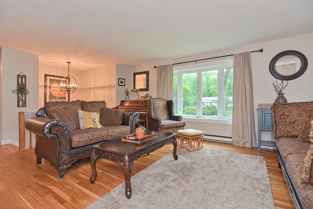 23 Carpenter Road Northbridge, MA 01588 - Photo 9 of 38 a living room with furniture and a large window
