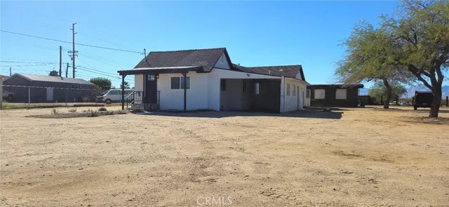 a wooden bench sitting in middle of a yard