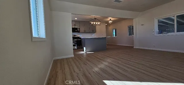 a view of cabinets and wooden floor