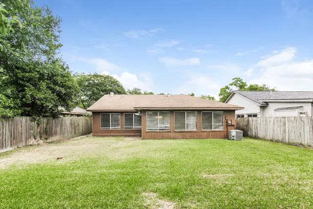 a front view of a house with a yard table and chairs