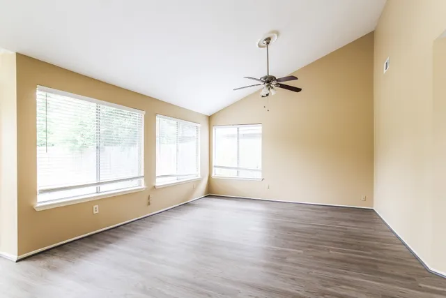 a view of an empty room with a window