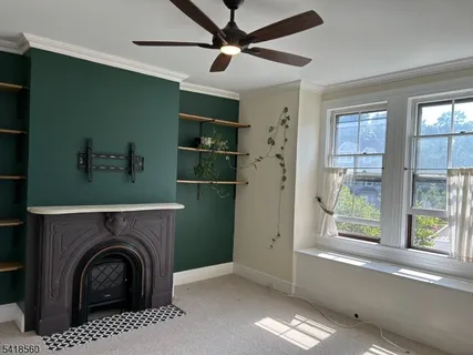 a view of a livingroom with washer and dryer