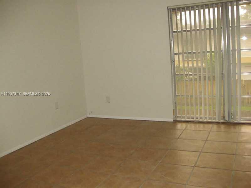 3321 Farragut Street, Unit 7A Hollywood, FL 33021 - Photo 4 of 8 a view of an empty room with a window