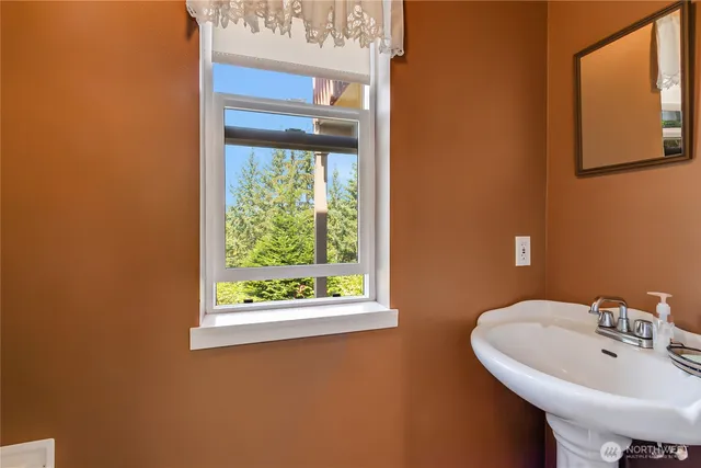 a bathroom with a sink and a window