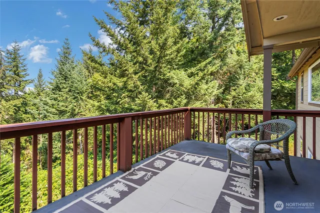a view of a two chairs in the balcony
