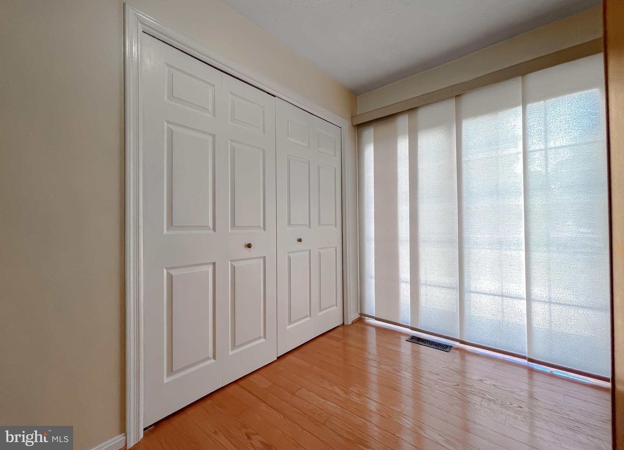 29799 Allen Road Mechanicsville, MD 20659 - Photo 13 of 49 a view of an empty room with wooden floor