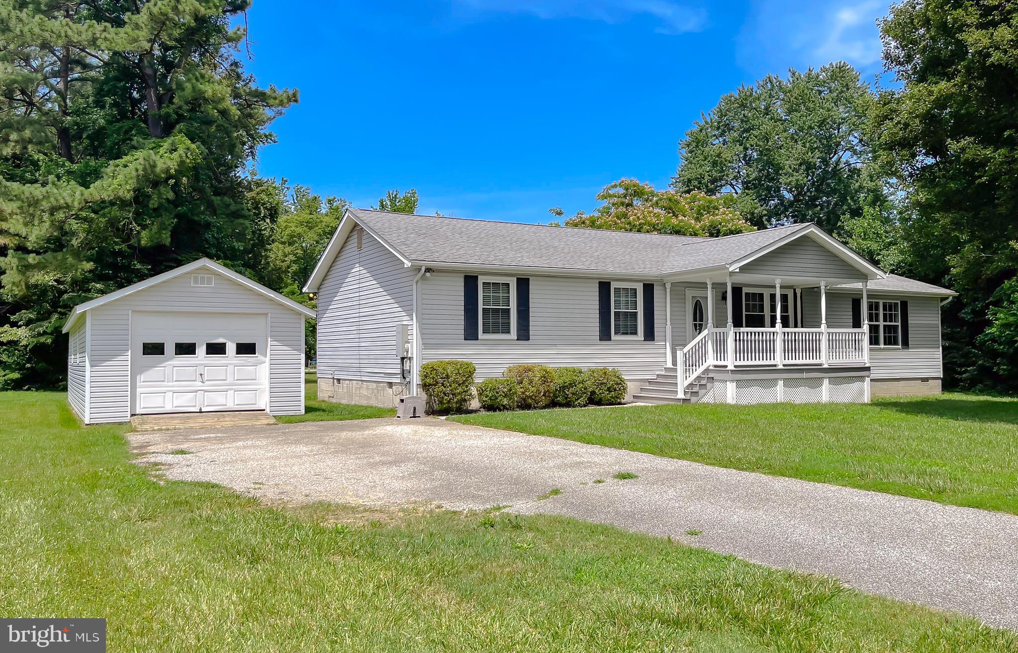 29799 Allen Road Mechanicsville, MD 20659 - Photo 2 of 49 a front view of a house with a garden