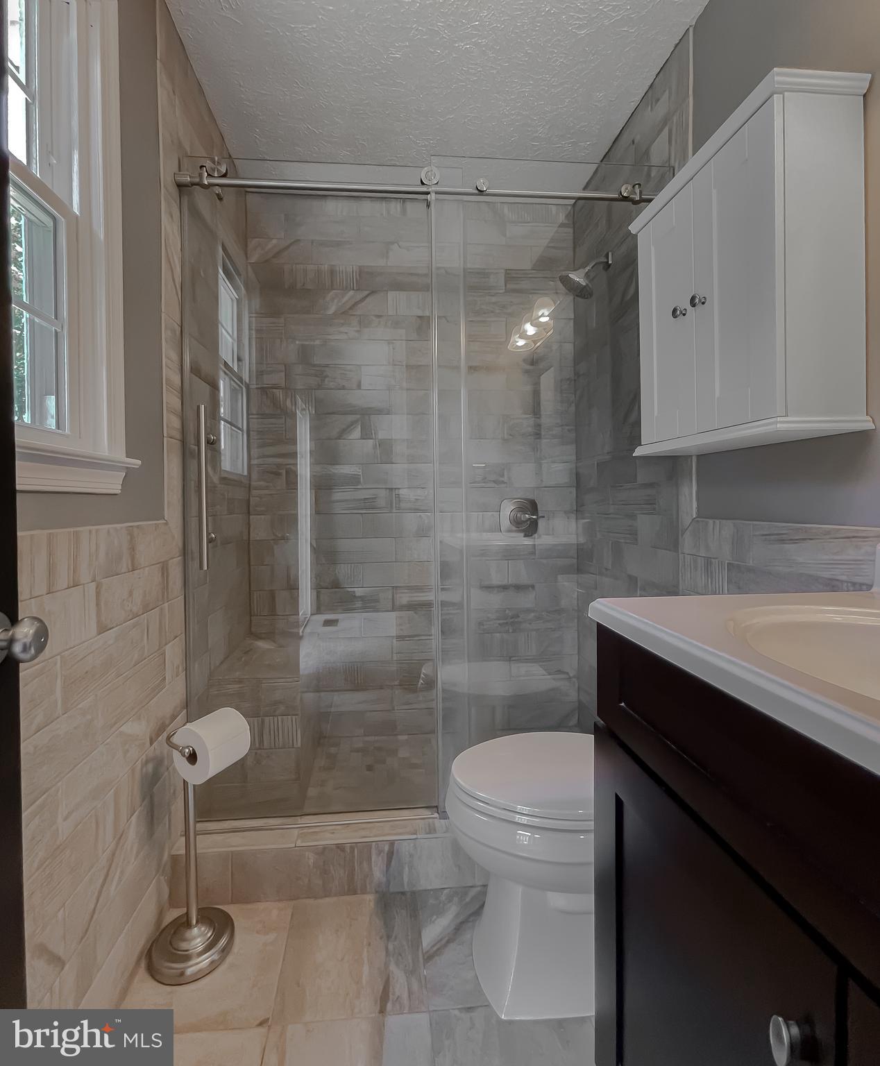 29799 Allen Road Mechanicsville, MD 20659 - Photo 23 of 49 a bathroom with a shower a toilet and sink