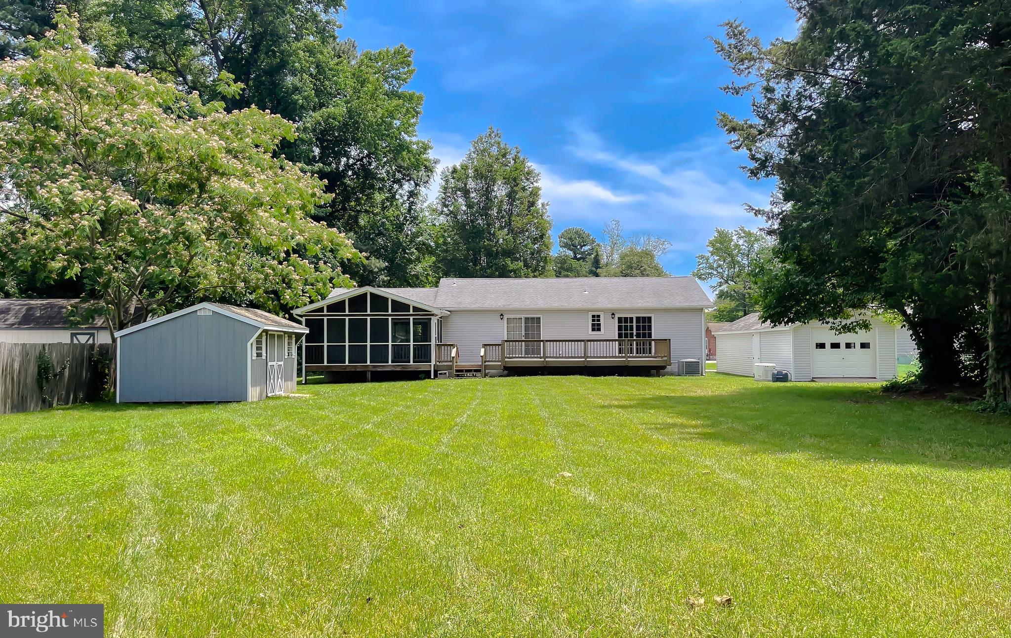 29799 Allen Road Mechanicsville, MD 20659 - Photo 35 of 49 a front view of a house with a garden and trees