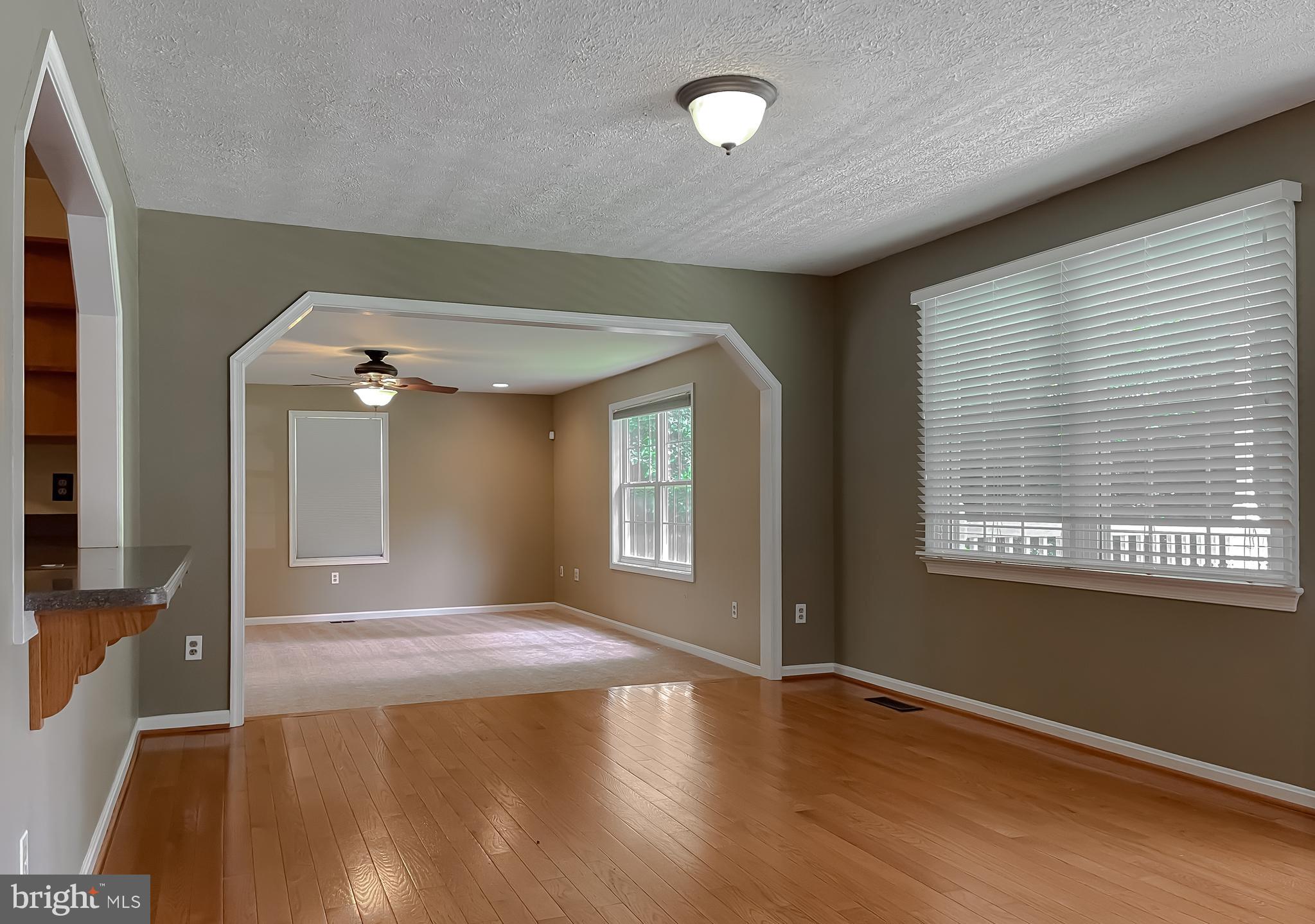 29799 Allen Road Mechanicsville, MD 20659 - Photo 7 of 49 wooden floor in an empty room with a window