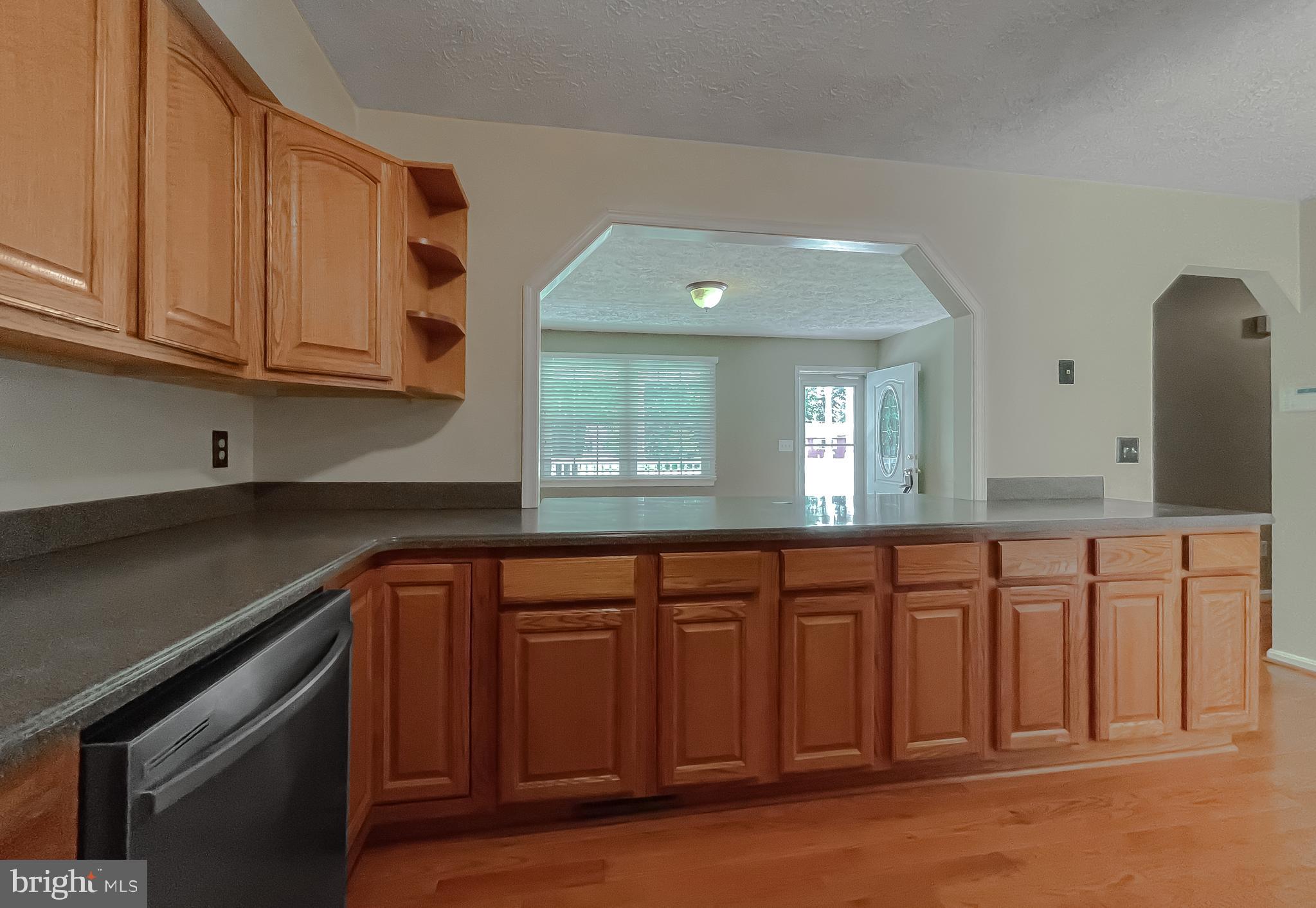 29799 Allen Road Mechanicsville, MD 20659 - Photo 10 of 49 a kitchen with granite countertop white cabinets and sink