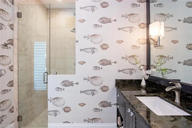 a bathroom with a sink and a mirror