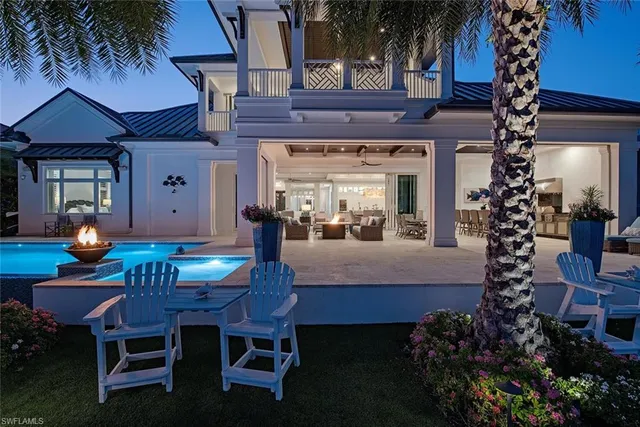 a dining room with a table and chairs