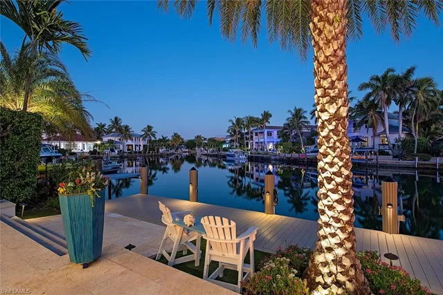 a view of a chairs and table in a patio
