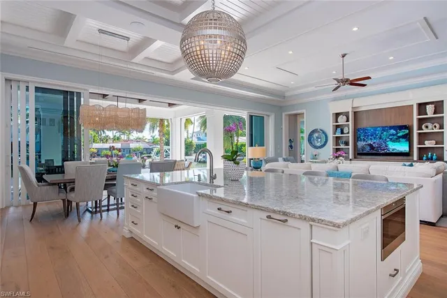 a kitchen with stainless steel appliances granite countertop a stove and a wooden floors