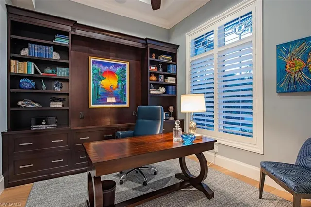 a workspace with furniture and book shelf