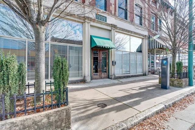 a view of a brick house with a large windows