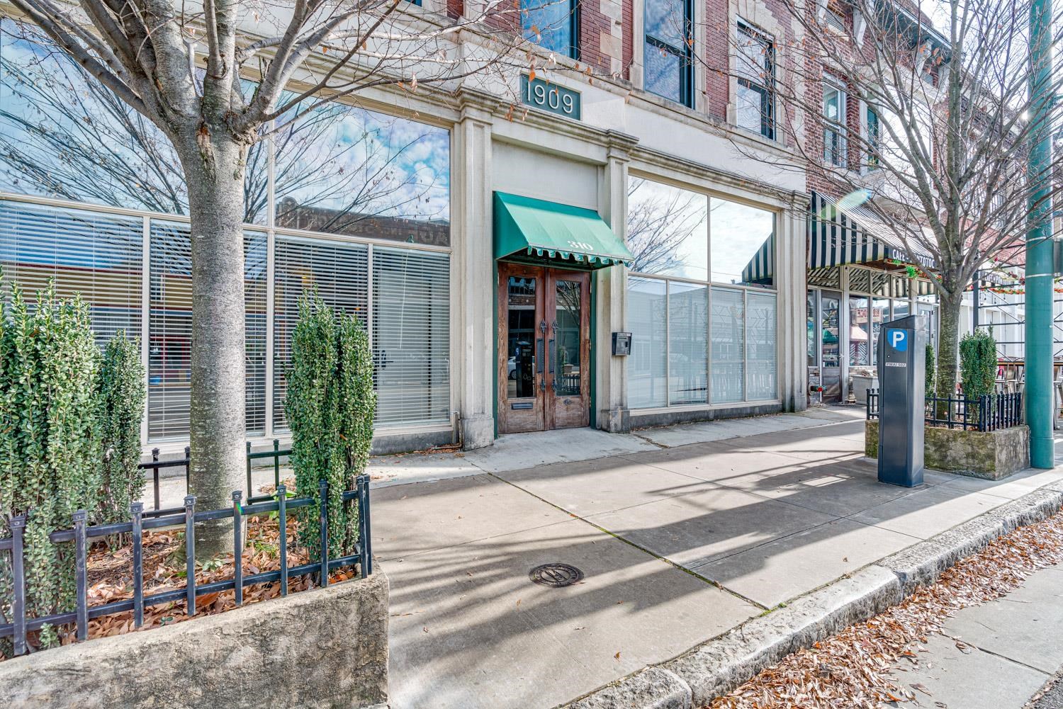 310 South Main Street, Unit 101 Memphis, TN 38103 - Photo 4 of 28 a view of a brick building with a tree in front