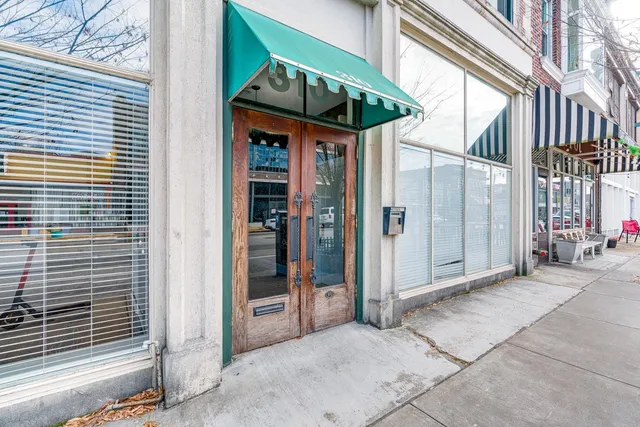 a bathroom with a glass shower door