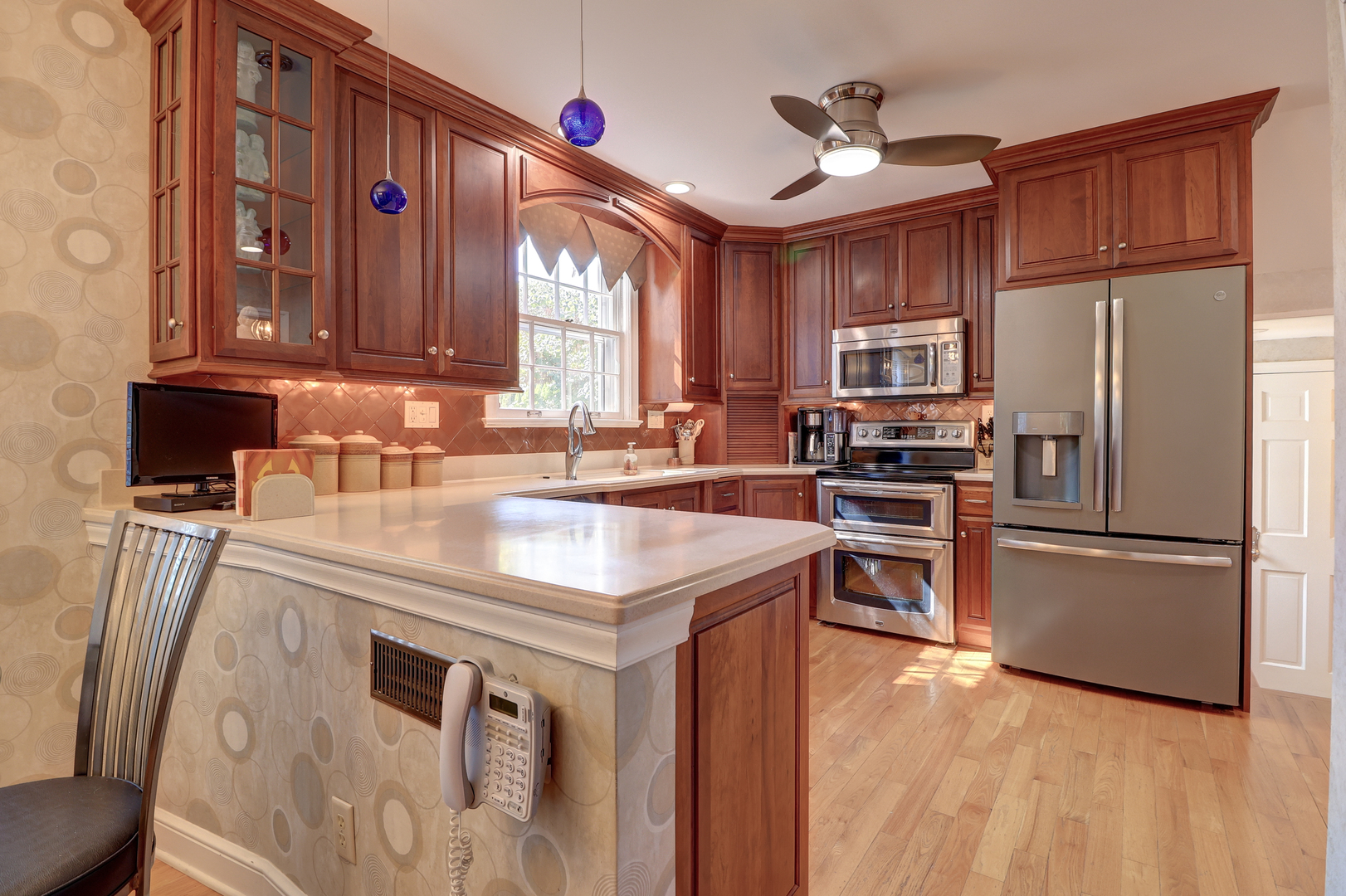 411 West 13th Street Sterling, IL 61081 - Photo 13 of 53 a kitchen with kitchen island granite countertop a sink appliances and cabinets