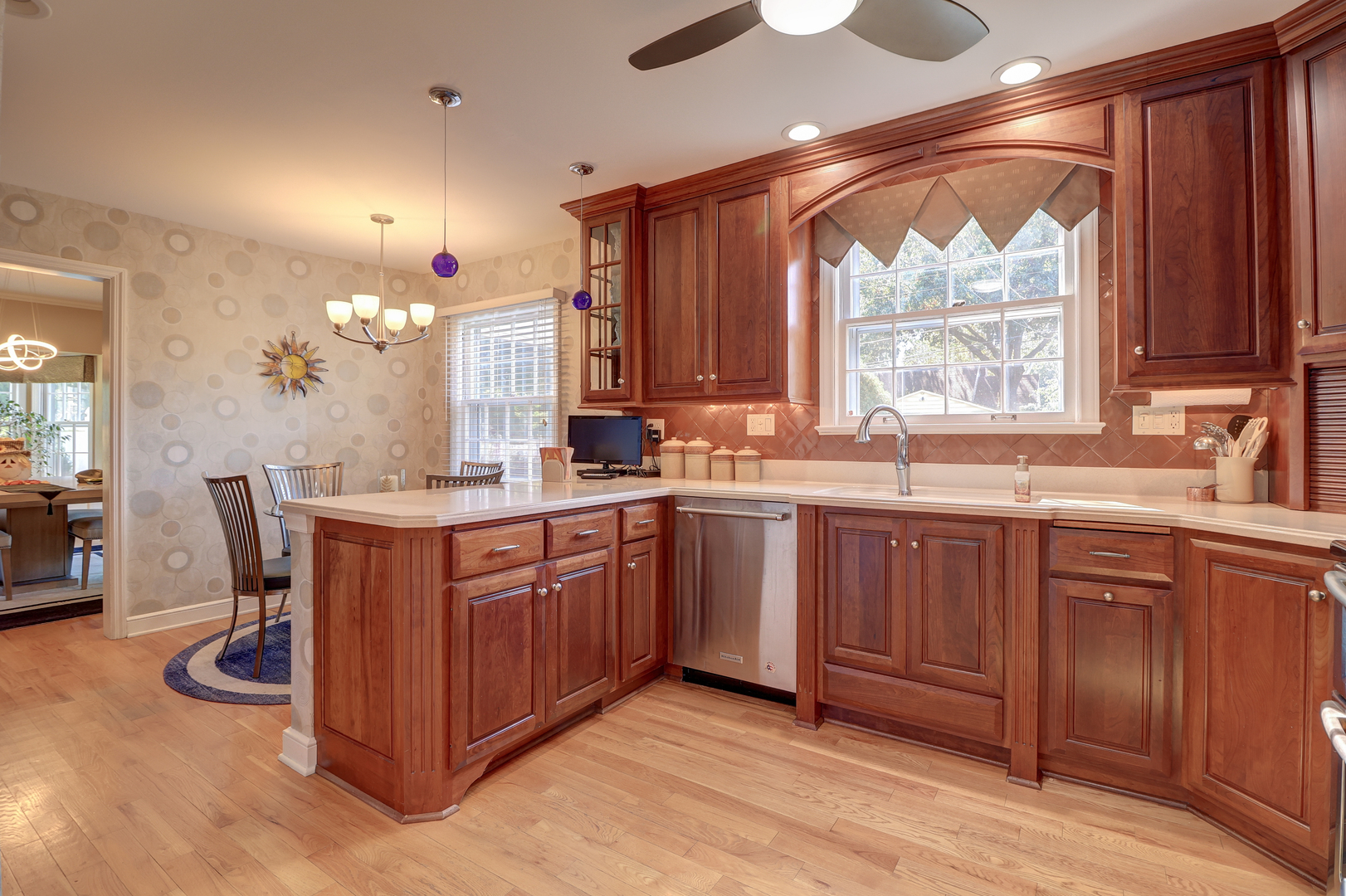 411 West 13th Street Sterling, IL 61081 - Photo 14 of 53 a kitchen with stainless steel appliances granite countertop wooden cabinets a sink and a stove