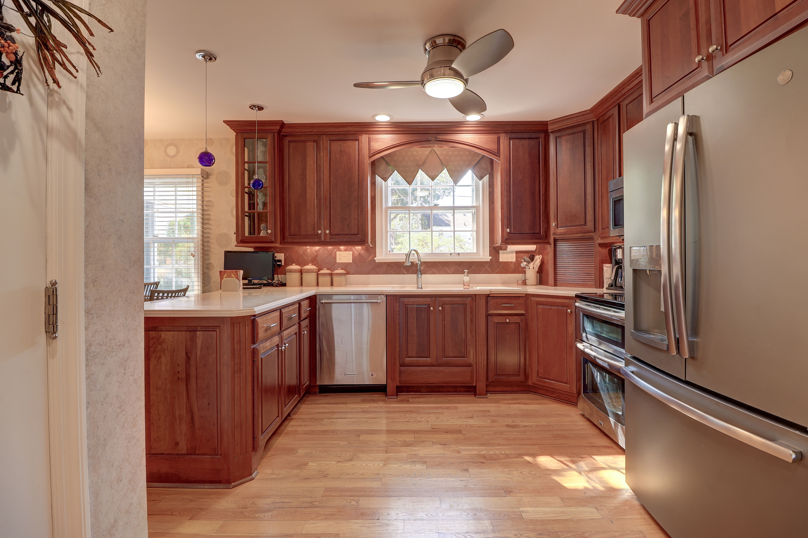 411 West 13th Street Sterling, IL 61081 - Photo 15 of 53 a kitchen with a sink appliances cabinets and a window