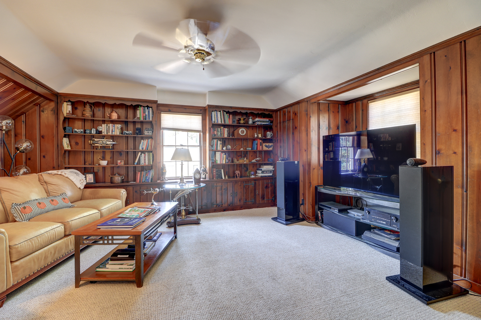 411 West 13th Street Sterling, IL 61081 - Photo 19 of 53 a living room with furniture a ceiling fan and a window