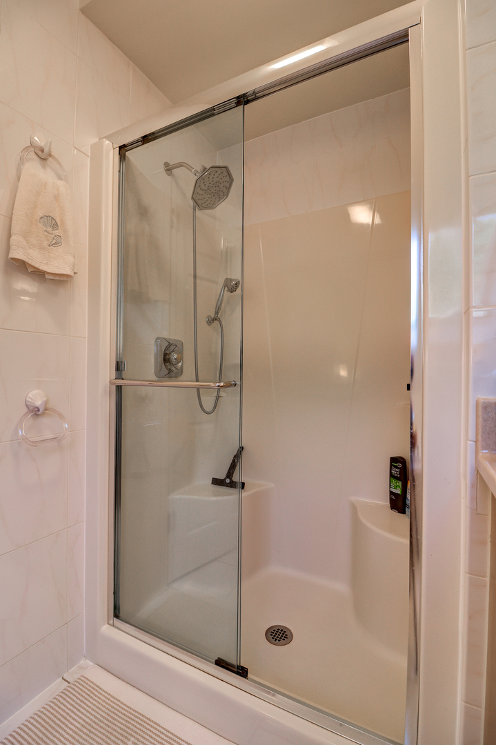 411 West 13th Street Sterling, IL 61081 - Photo 23 of 53 a bathroom with a glass shower door