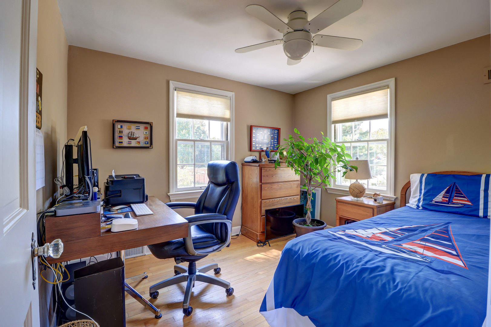 411 West 13th Street Sterling, IL 61081 - Photo 25 of 53 a bedroom with a bed and a desk